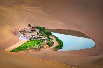 The Echoing Sand Dune and the Crescent Lake